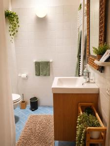 a bathroom with a sink and a toilet at Casa Giorgia Collio Suite in Cormòns +34 photos