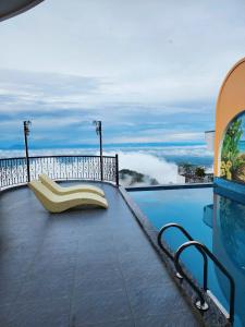a swimming pool with a bench on a balcony at Lamay Villa Tam Đảo in Tam Ðảo +26 photos