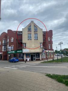 a building with a circle on the side of it at Apartament Kościuszki in Malbork