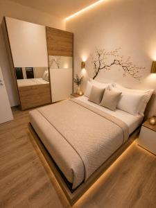 a bedroom with a large bed with a large mirror at Sicily Luxury Apartments in Palermo