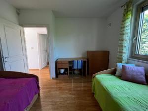 a living room with two beds and a table at Villa Aria in Marčana