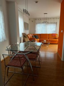 a living room with a glass table and chairs at Villa Aria in Marčana