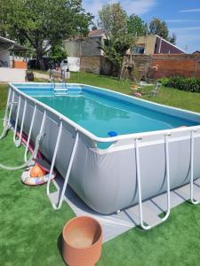 a pool deck with a trampoline and a pool table at Gite espumante in Mamarrosa