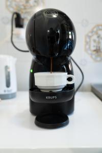 a coffee maker is sitting on a counter at Due passi dal mare - Residence Sirena in Punta Marina