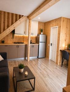 a kitchen and a living room with a refrigerator at Luxury Cottage Resort in Patara-Tsemi