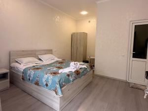 a bedroom with a large bed in a room at Oasis in Akhaltsikhe