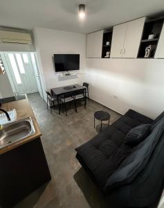 a living room with a couch and a table at Apartment Zart 2 in Dekani