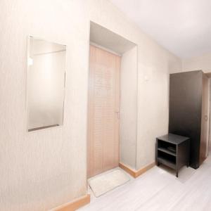 an empty room with a door and a black cabinet at Кардиоцентр in Dnipro