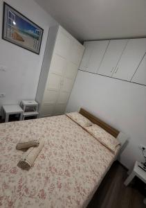 a bedroom with a bed with a dresser and a pillow at Apartment Zart 2 in Dekani