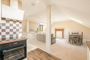 a kitchen and living room with a dining room at Chestnut Cottage in Bix +16 photos