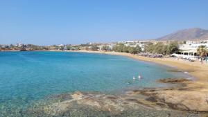 an aerial view of a beach with people in the water at Marpissa - Traditional House in Márpissa