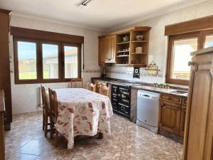 a kitchen with a table with a table cloth on it at El Trocador - 12805 in Ajo +15 photos