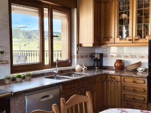 a kitchen with a sink and a window at El Trocador - 12805 in Ajo