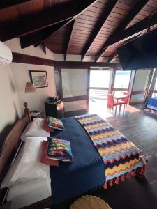 a bedroom with a large bed in a room at Morada das marés in Angra dos Reis