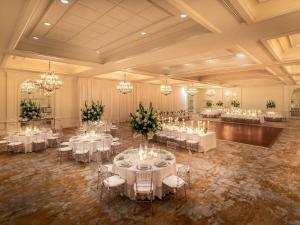 a banquet hall with white tables and chairs and chandeliers at The Fairmont Washington DC in Washington, D.C. +173 photos
