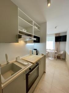 a kitchen with a sink and a counter top at LEO Apartments in Leonberg