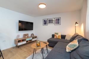 a living room with a couch and a table at Balatura House in Trogir