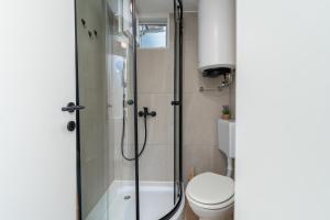 a bathroom with a shower and a toilet at Balatura House in Trogir +37 photos