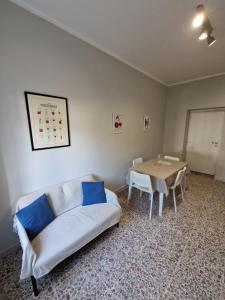a living room with a couch and a table at La Spiritiera in Minturno +17 photos