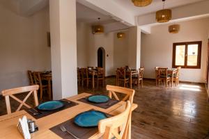 a dining room with a table and chairs at Azad Siwa Hotel in Siwa