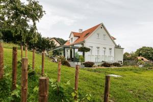 a house with a fence in front of it at Cantilly Garden in Samobor
