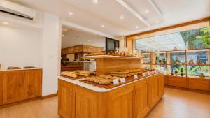 a bakery with a bunch of bread on display at Angkor Mansion & Apartment in Siem Reap