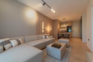 a living room with a couch and a table at Home apartments in Mostar