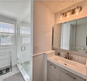 a bathroom with a sink and a shower at Katama Family Fun in Edgartown