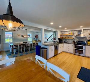 a kitchen and dining room with a table and chairs at Katama Family Fun in Edgartown