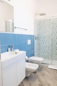 a bathroom with a sink and a toilet and a shower at La dolce vita in Agerola +36 photos