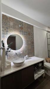 a bathroom with a sink and a mirror at Bogart 206 in Guadalajara +29 photos