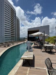 a swimming pool on the roof of a building at Flat Parque do Cais in Recife By Flatbpaiva in Recife