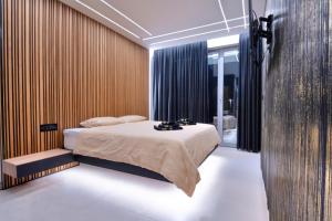 a bedroom with a bed in a room at Timm - Luxury Villas in Vodice +38 photos