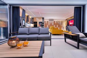 a living room with a couch and a table at Timm - Luxury Villas in Vodice