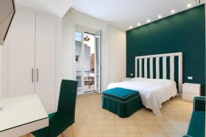 Postel nebo postele na pokoji v ubytování Sorrento Apartments One
