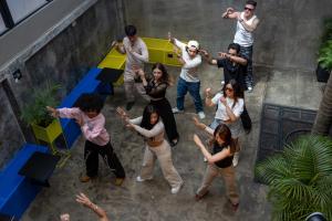 a group of people standing around a table at Hostal Joy Calle 85 in Bogotá +35 photos