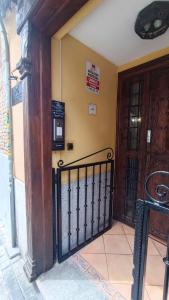 a entrance to a building with a gate and a door at Hostal Maria Ronda in Madrid