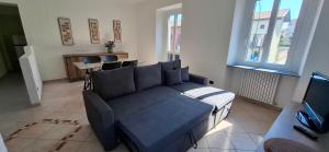 a living room with a couch and a table at casArona in Arona