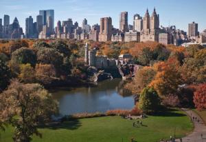 a view of a park with a city in the background at Lavish Columbus Circle Manhattan Apartment by Central Park & Times Square ADULTS ONLY in New York