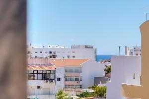 a view of the city from a building at Vale do Farol Cozy Retreat in Quarteira