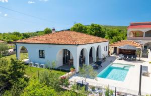 an aerial view of a house with a swimming pool at Villa Olivarum in Stankovci