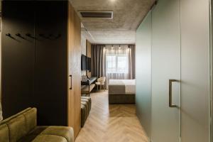 a room with a bed and a couch and a bedroom at Campeador Expo in Bucharest +20 photos