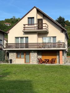 a large house with a balcony on top of it at Katalin vendégház felső szint in Visegrád