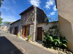 an old building on the side of a street at le Chalet in Saint-Loup-sur-Thouet