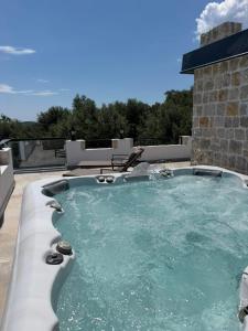 a hot tub on the roof of a house at Countryside in Ulcinj
