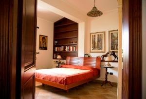 Voodi või voodid majutusasutuse Il Veliero E I Girasoli toas