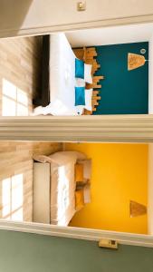 two shelves of a bed with pillows at L'échappée Verte in Saint-Jean-la-Bussière
