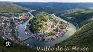 an aerial view of a town next to a river at Chez Mamie in Donchery