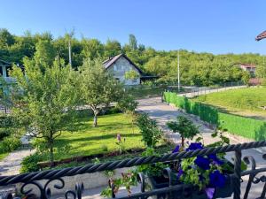 a view of a garden from a balcony at Apartmani Hrastik 2 in Bihać