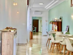 a kitchen and dining room with a table and chairs at Maison Pompei in Pompei
